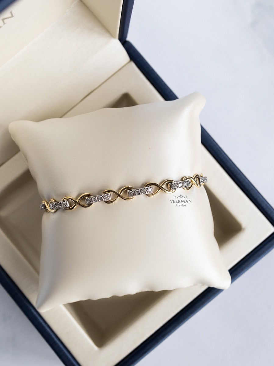 Bicolor schakelarmband met diamant 0,80crt